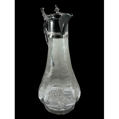 47A - AN EARLY 20TH CENTURY SILVER PLATED AND GLASS COMMEMORATIVE CLARET JUG
Having etched portraits of Ed... 