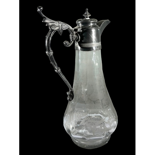 47A - AN EARLY 20TH CENTURY SILVER PLATED AND GLASS COMMEMORATIVE CLARET JUG
Having etched portraits of Ed... 