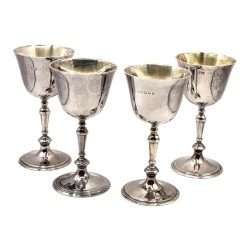 20 - CARRINGTON & CO., A SET OF FOUR SILVER GOBLETS, HALLMARKED LONDON, 1966 & 1969
Reeded stem decoratio... 