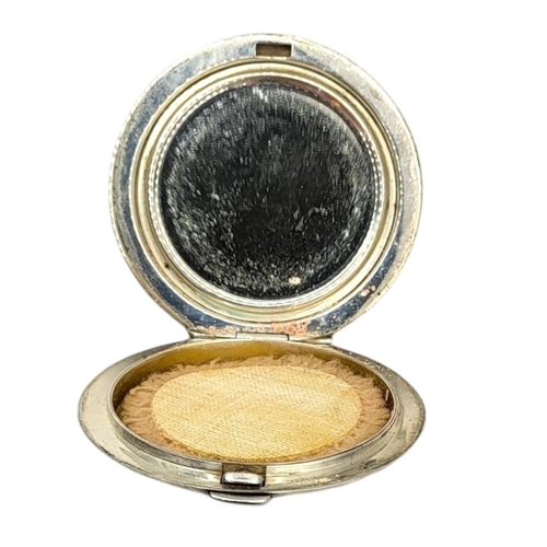 44 - R. BLACKINTON & CO. FOR CARTIER, A LATE 1940’S AMERICAN STERLING SILVER COMPACT
Circular form with p... 