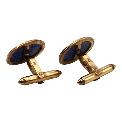 48 - A VINTAGE 14CT GOLD AND LAPIS LAZULI OVAL CUFFLINKS
Polished flat cut oval Lapis Lazuli insert, held... 