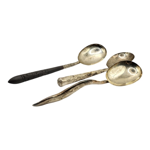 227 - THREE 20TH CENTURY ASIAN SILVER SERVING SPOONS
All having a variation of chased and engraved scrolli... 