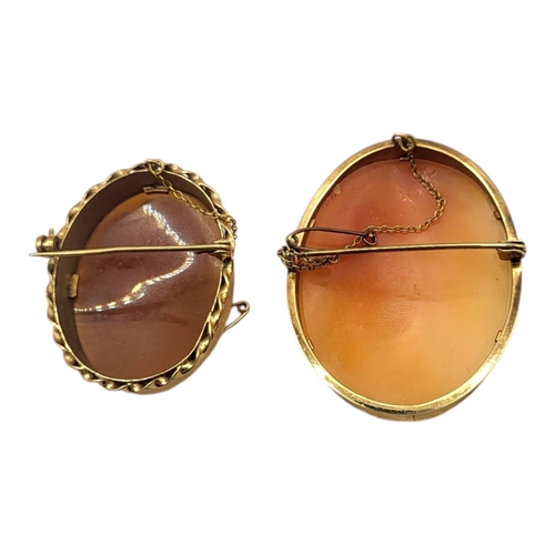 62 - TWO 9CT GOLD AND SHELL CAMEO BROOCHESFirst depicting a bust of a lady, the second depicting three p... 