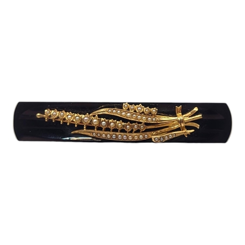 74 - A VICTORIAN YELLOW METAL, ONYX AND PEARL BROOCH, YELLOW METAL TESTED AS 9CT GOLDFront having stylis... 