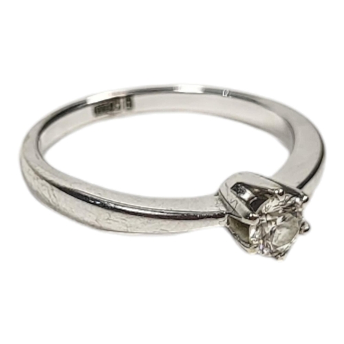 99A - A 14CT WHITE GOLD AND DIAMOND SOLITAIREHaving a single round cut stone in plain design(approx 0.25... 
