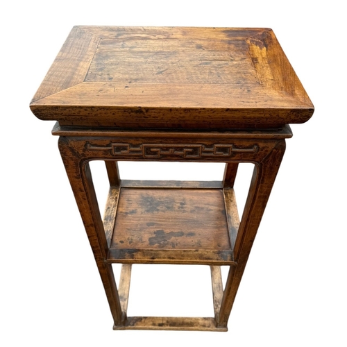 10 - THREE CHINESE HARDWOOD ITEMS
To include a carved two tier stand, hat chair and small table.
(stand 8... 