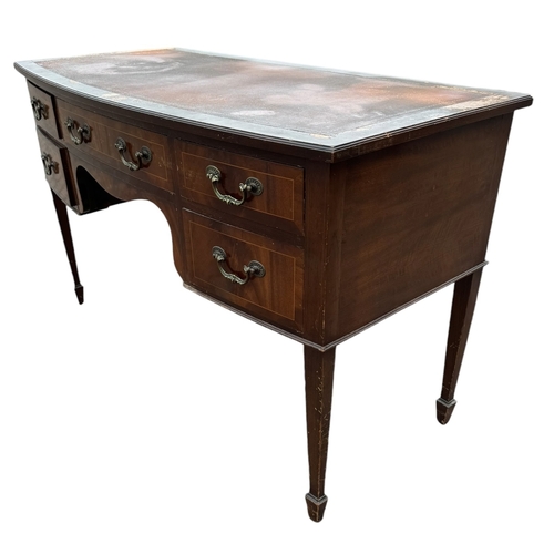 12 - A REGENCY DESIGN MAHOGANY WRITING TABLE
With five drawers fitted with gilt metal handles, raised on ... 