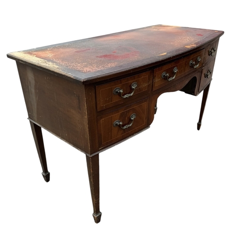 12 - A REGENCY DESIGN MAHOGANY WRITING TABLE
With five drawers fitted with gilt metal handles, raised on ... 