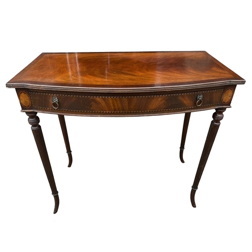 16 - A REGENCY DESIGN MAHOGANY AND INLAY SIDE TABLE
The bow front top above a single drawer, raised on fo... 