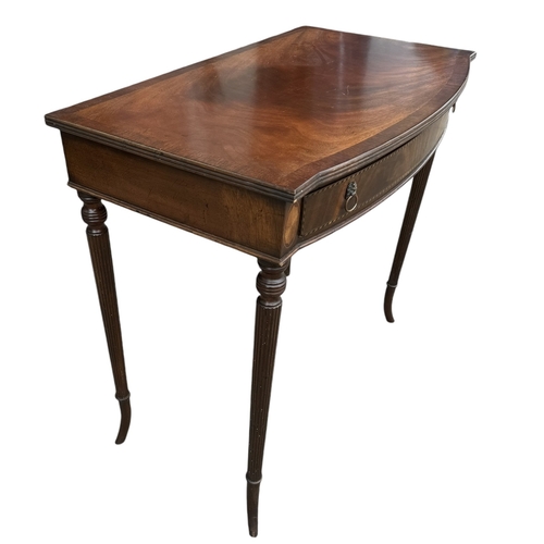 16 - A REGENCY DESIGN MAHOGANY AND INLAY SIDE TABLE
The bow front top above a single drawer, raised on fo... 