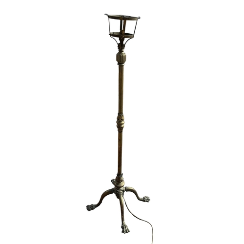 20 - A 19TH CENTURY HEAVY BRASS FLOOR STANDING LAMP
Raised on lion paw feet.
(h 135cm)