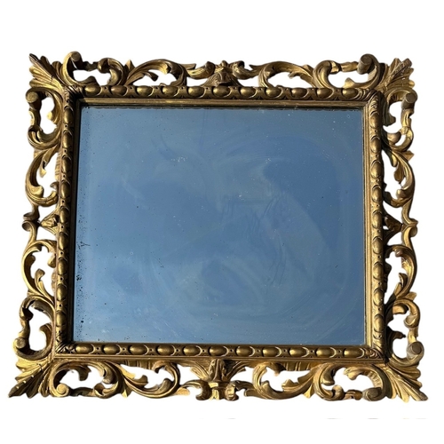 22 - A 19TH CENTURY CARVED GILTWOOD FLORENTINE DESIGN MIRROR.
(95cm x 84cm)