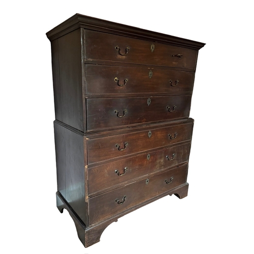 30 - A GEORGE III MAHOGANY CHEST ON CHEST
Of six long drawers fitted with swan neck handles, raised on br... 