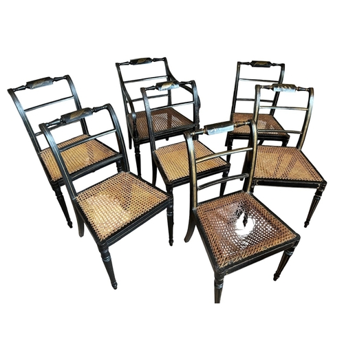 32 - A SET OF SEVEN REGENCY PAINTED CANE SEATED CHAIRS
Stamped to underside.