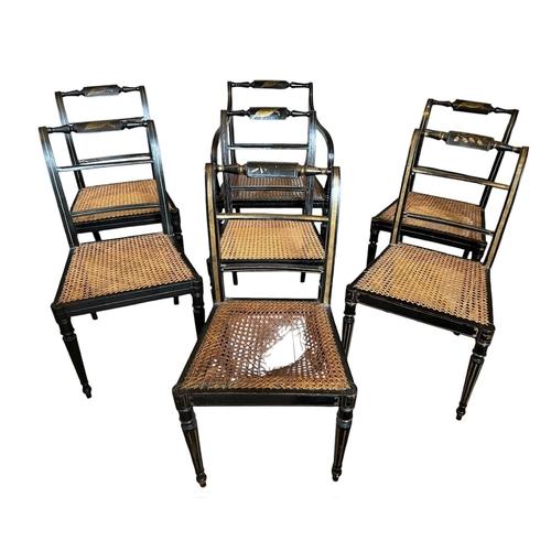 32 - A SET OF SEVEN REGENCY PAINTED CANE SEATED CHAIRS
Stamped to underside.