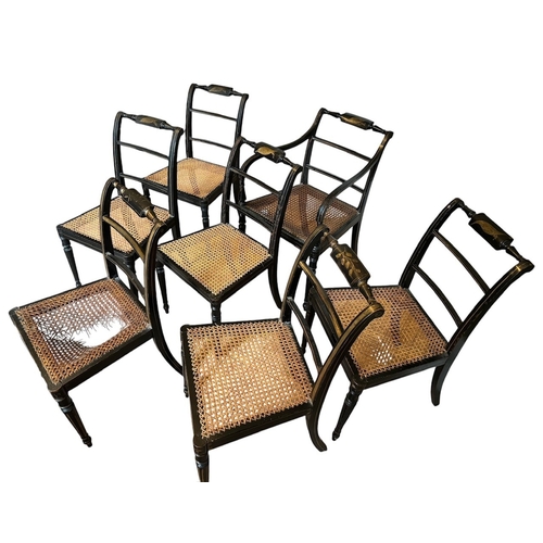 32 - A SET OF SEVEN REGENCY PAINTED CANE SEATED CHAIRS
Stamped to underside.