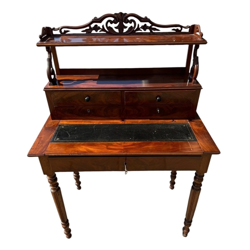 40 - A 19TH CENTURY VICTORIAN FLAME MAHOGANY LADIES’ WRITING TABLE
With scrolling and pieced gallery abov... 