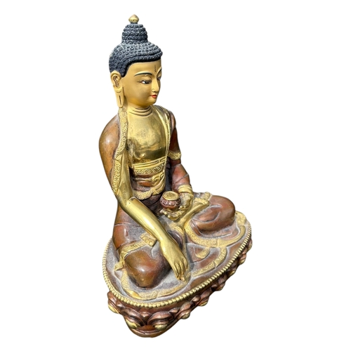 116 - A BRONZE AND GILT FIGURE OF SHAKYAMUNI. 
(h 20cm x w 13.5cm x d 9cm)