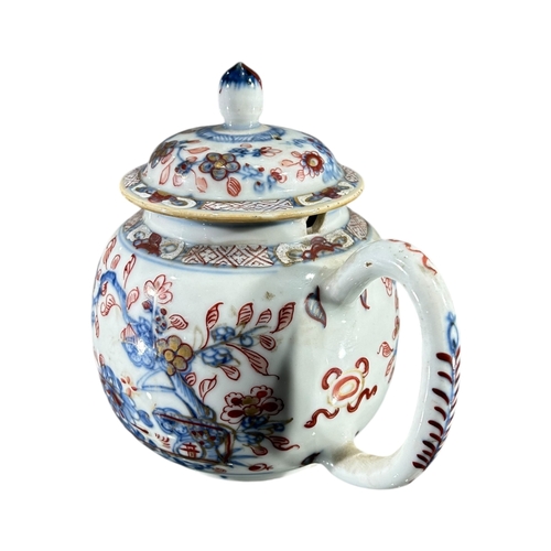 124 - A 19TH CENTURY CHINESE EXPORT TEAPOT
Having white metal spout, body decorated with floral foliage in... 