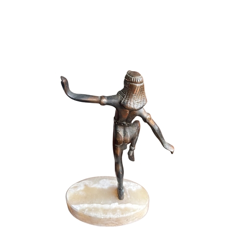 144 - AN ART DECO METAL FIGURE OF A DANCING EGYPTIAN LADY. 
(h 20.7cm x w 14.5cm x d 9cm)