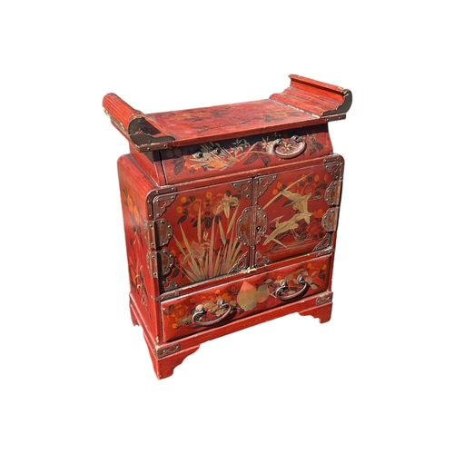 154 - A JAPANESE MEIJI RED LACQUERED TABLETOP TRINKET/JEWELLERY CABINET
Together with a Chinese red lacque... 