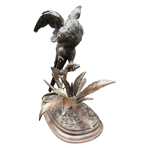 184 - FERDINAND PAUTROT, FRENCH, 1832 - 1874, A 19TH CENTURY BRONZE SCULPTURE OF A PARROT & BUTTERFLY ON N... 