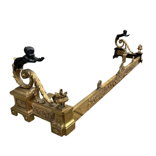 186 - A 19TH CENTURY FRENCH LOUIS XVI DESIGN GILT AND PATINATED BRONZE ANDIRONS
The ends with two putti on... 