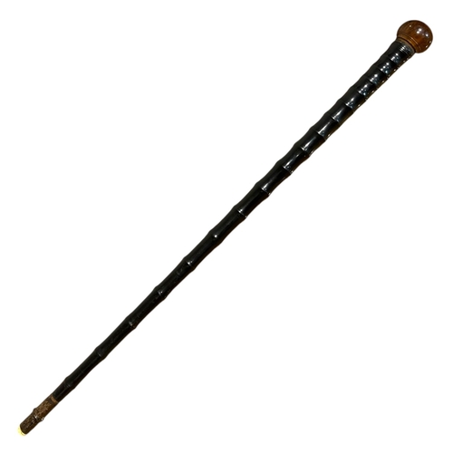 188 - A 19TH CENTURY EBONISED BAMBOO WALKING STICK
Having burr wood knob handle, together with another wal... 