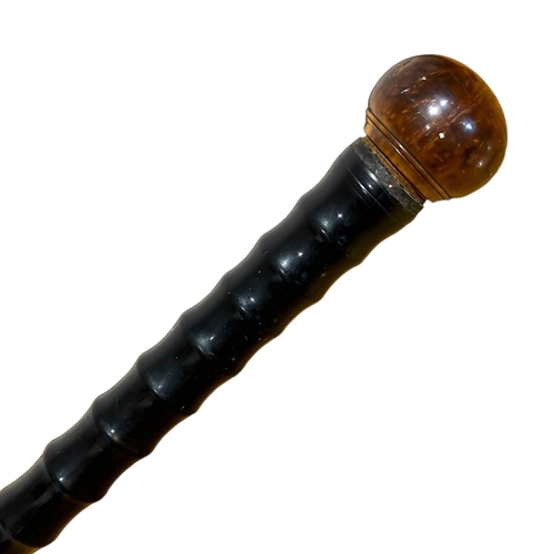 188 - A 19TH CENTURY EBONISED BAMBOO WALKING STICK
Having burr wood knob handle, together with another wal... 