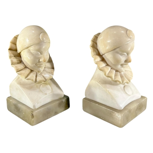 103 - A 20TH CENTURY ITALIAN ART DECO ALABASTER CARVED BUSTS OF PIERROT THE CLOWN BOOKENDS.
(h 14cm x w 7.... 