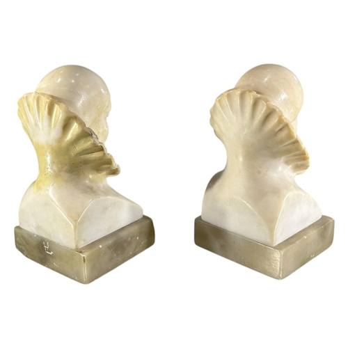 103 - A 20TH CENTURY ITALIAN ART DECO ALABASTER CARVED BUSTS OF PIERROT THE CLOWN BOOKENDS.
(h 14cm x w 7.... 