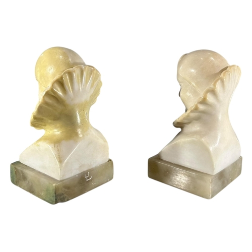 103 - A 20TH CENTURY ITALIAN ART DECO ALABASTER CARVED BUSTS OF PIERROT THE CLOWN BOOKENDS.
(h 14cm x w 7.... 