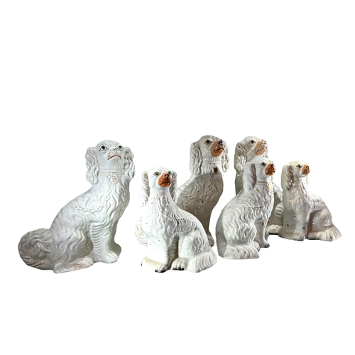 107 - A COLLECTION OF SIX 19TH CENTURY VICTORIAN STAFFORDSHIRE KING CHARLES SPANIEL COMFORTER DOG FIGURES
... 