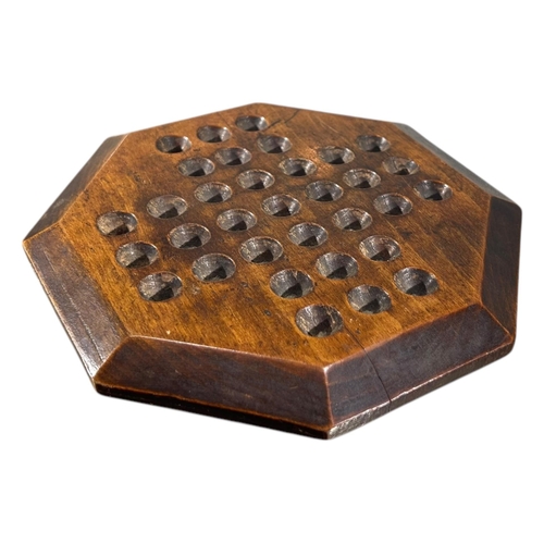 119 - A 19TH CENTURY VICTORIAN OCTAGONAL CARVED WOOD SOLITAIRE GAME
With thirty-two 19th Century glass mar... 