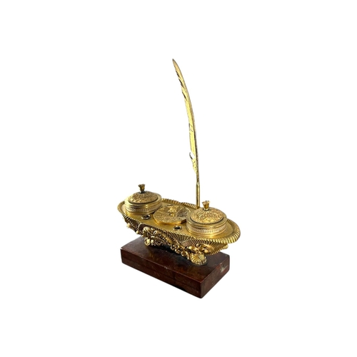 121 - A 19TH CENTURY FRENCH CHARLES X REGENCY GILT BRONZE AND MARBLE INKWELL
Ovular sarcophagus form with ... 