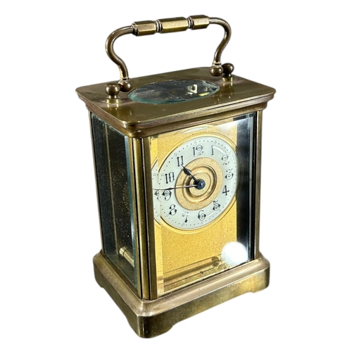 169 - A LATE 19TH/EARLY 20TH CENTURY FRENCH GILT BRASS CARRIAGE CLOCK
Having white enamel dial with black ... 