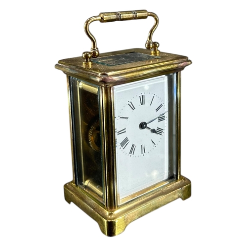 171 - A LATE 19TH/EARLY 20TH CENTURY FRENCH GILT BRASS CARRIAGE CLOCK
Having white enamel dial with black ... 