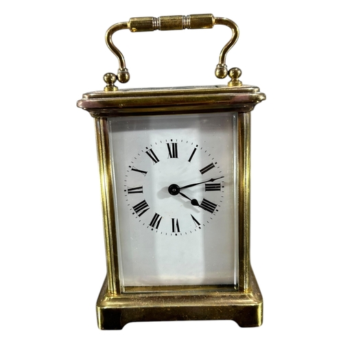 171 - A LATE 19TH/EARLY 20TH CENTURY FRENCH GILT BRASS CARRIAGE CLOCK
Having white enamel dial with black ... 