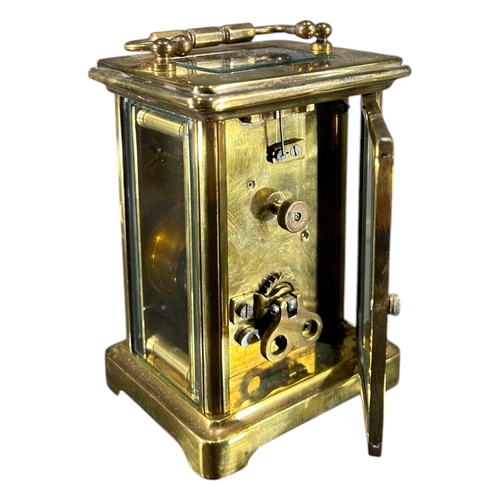 171 - A LATE 19TH/EARLY 20TH CENTURY FRENCH GILT BRASS CARRIAGE CLOCK
Having white enamel dial with black ... 