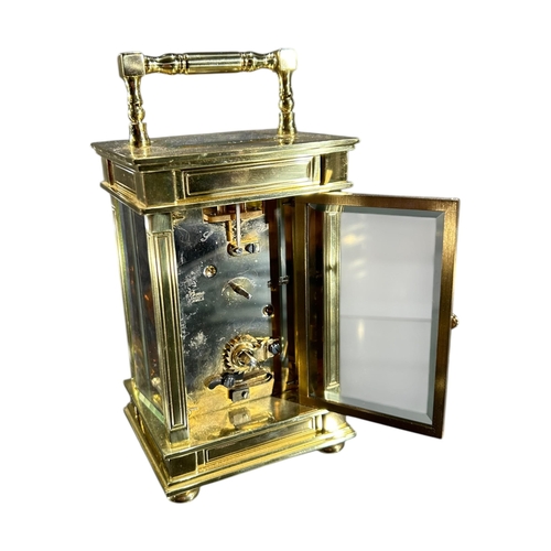 171 - A LATE 19TH/EARLY 20TH CENTURY FRENCH GILT BRASS CARRIAGE CLOCK
Having white enamel dial with black ... 