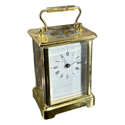 179 - TAYLOR & BLIGH, A 20TH CENTURY ENGLISH ELEVEN JEWELS GILT BRASS CARRIAGE CLOCK
Having white enamel d... 