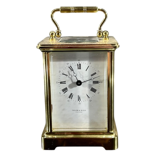 179 - TAYLOR & BLIGH, A 20TH CENTURY ENGLISH ELEVEN JEWELS GILT BRASS CARRIAGE CLOCK
Having white enamel d... 