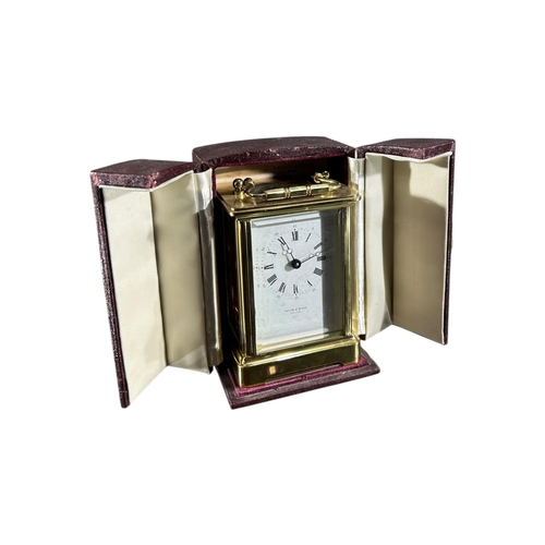 179 - TAYLOR & BLIGH, A 20TH CENTURY ENGLISH ELEVEN JEWELS GILT BRASS CARRIAGE CLOCK
Having white enamel d... 