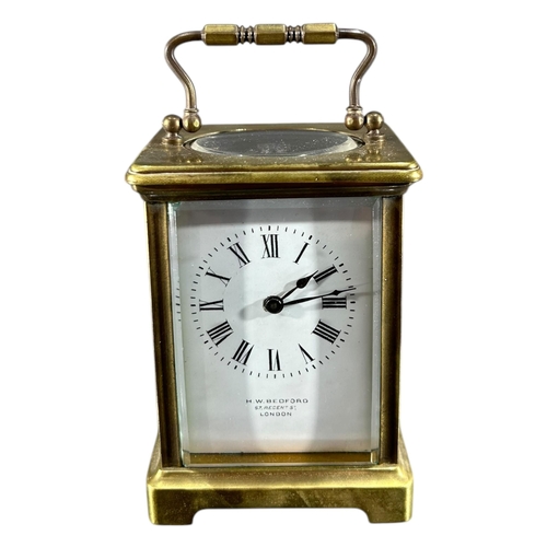 183 - H.W. BEDFORD, LONDON, AN EARLY 20TH CENTURY GILT BRASS CARRIAGE CLOCK Having white enamel dial with ... 