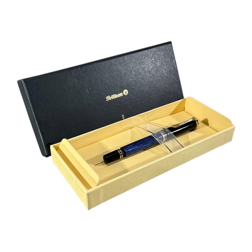 187 - PELIKAN M800 (OLD STYLE) BLUE STRIPED FOUNTAIN PEN
Having an 18ct gold nib.