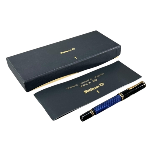 187 - PELIKAN M800 (OLD STYLE) BLUE STRIPED FOUNTAIN PEN
Having an 18ct gold nib.