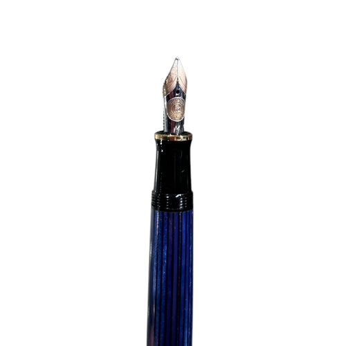 187 - PELIKAN M800 (OLD STYLE) BLUE STRIPED FOUNTAIN PEN
Having an 18ct gold nib.