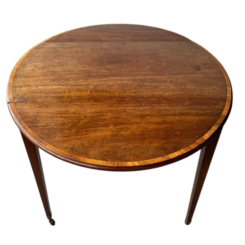 21 - A LATE 18TH CENTURY SHERATON PERIOD MAHOGANY AND SATINWOOD BANDED PEMBROKE TABLE
Oval form, with sin... 