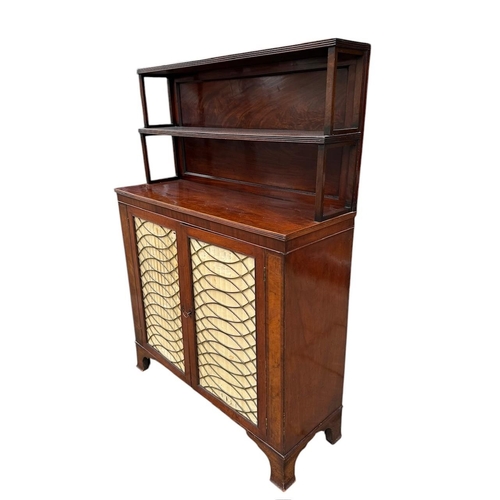 23 - A 19TH CENTURY MAHOGANY CHIFFONIER
With shelved gallery above two silk lined brass grilled doors.
(h... 