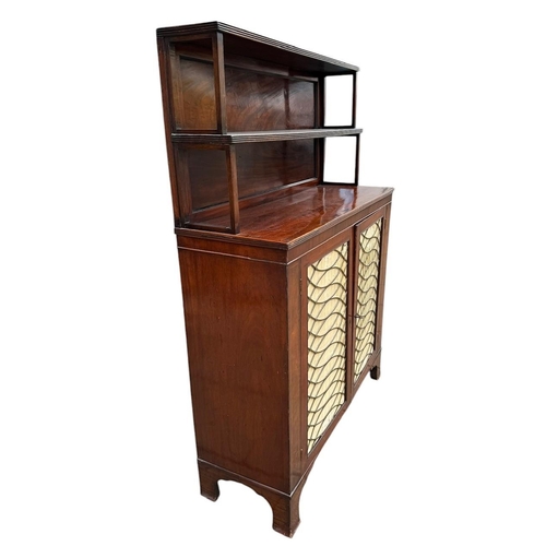 23 - A 19TH CENTURY MAHOGANY CHIFFONIER
With shelved gallery above two silk lined brass grilled doors.
(h... 